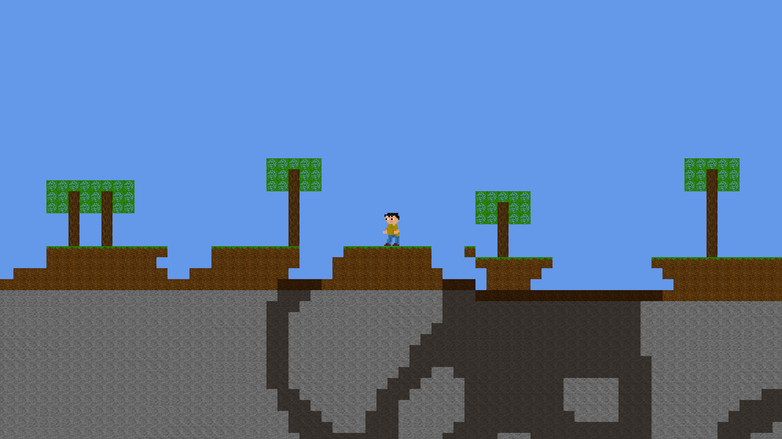 Player standing on grass with big cave hole in the ground on the left, and some treas nearby