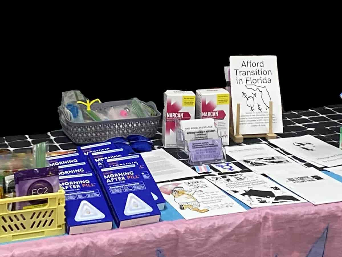 A photo of the zine as one of the items offered on a table at a queer resource event in Florida.