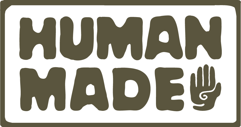 A logo of a hand with the words Human Made