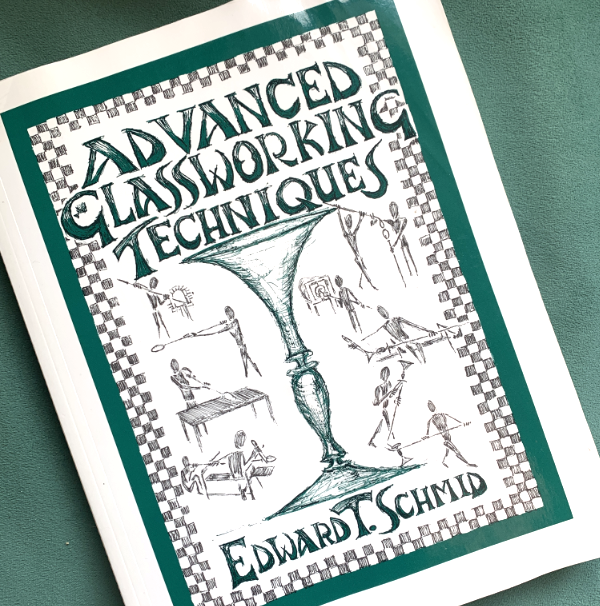 The book Advanced Glassworking Techniques by Edward T Schmid. The cover is hand drawn in green ballpoint pen.