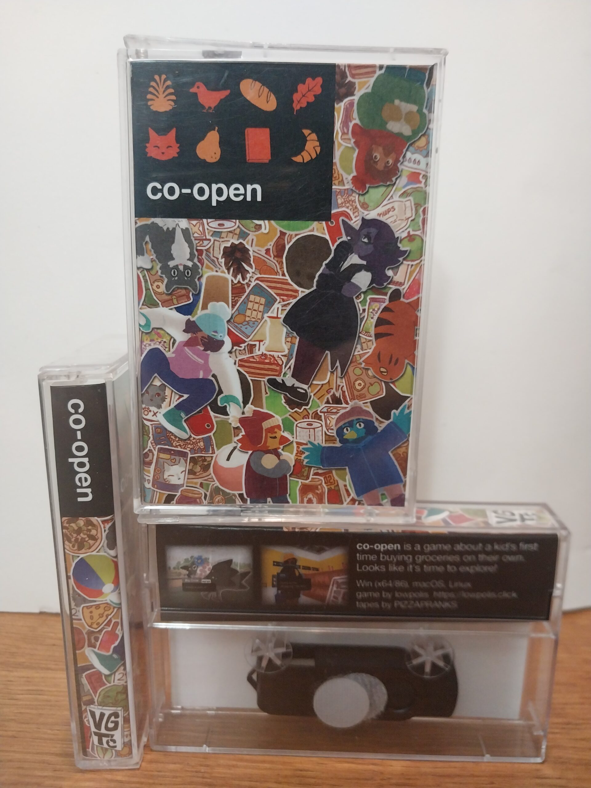 A photo of cassette tape cases on a table with various characters and items from the video game