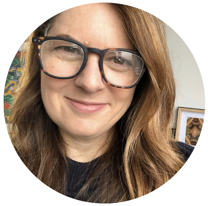 Deb Polson smiles in a close up selfie in  home setting.