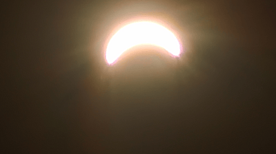 A blazing eclipse crescent cresting the dark of the gas giant — the vantage a duel opens on