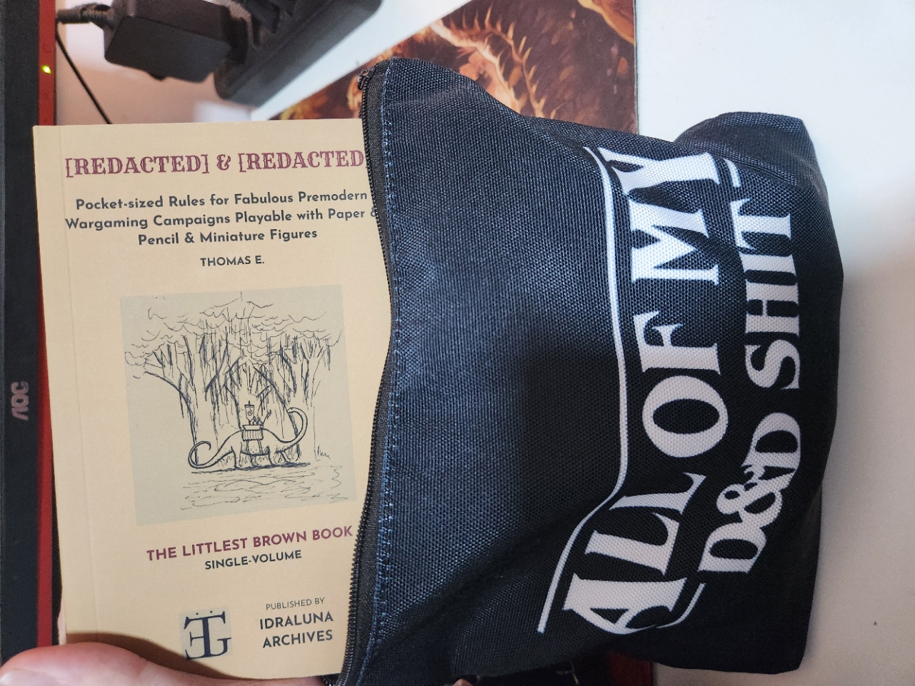 The Littlest Brown Book fiting inside my black bag