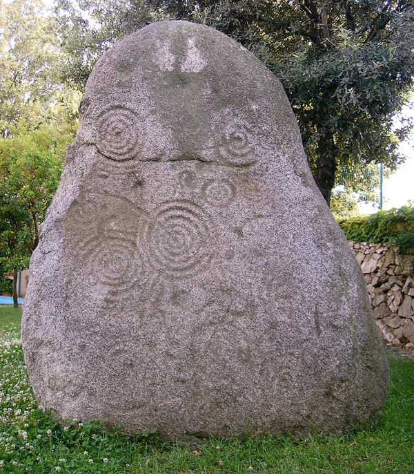 Massive standing stone, showing cup-circles with lines around them and lines between