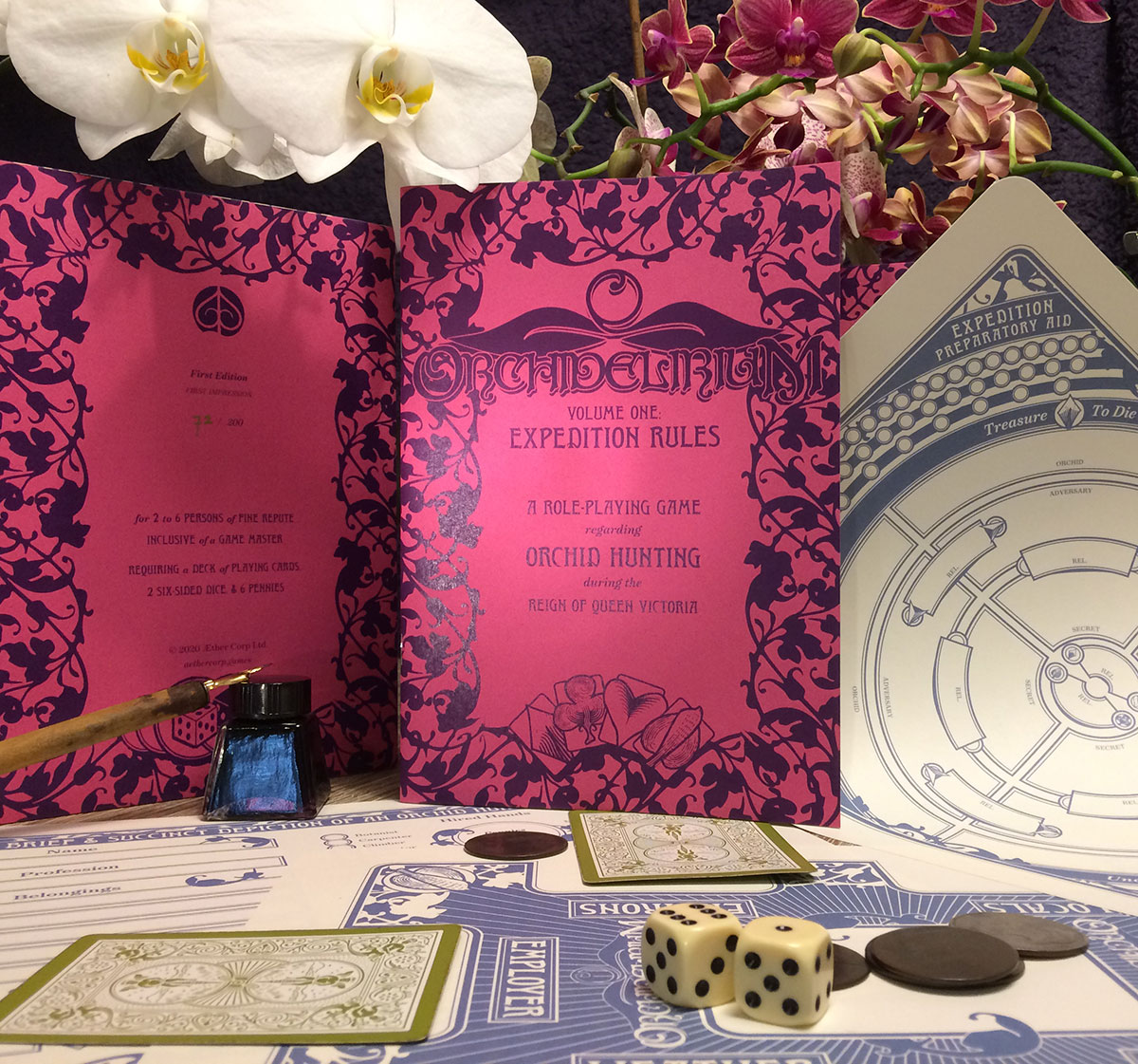 Photo of first edition zine with pink cover surrounded by orchids and print outs