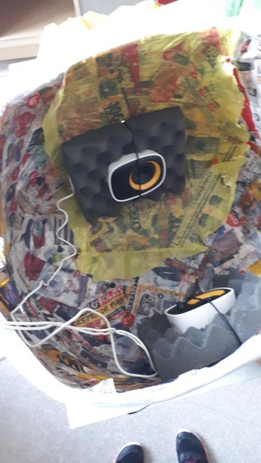 The papier mâché helmet - Speakers are put inside to isolate the player from their surroundings