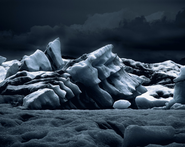 A grayscale ice formation at night