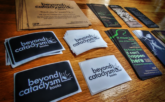 Photo of Beyond Cataclysm bookmarks, stickers and other nice things.